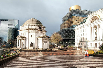 View of Birmingham’s Centenary Square featuring the Hall of Memory, modern Library of Birmingham, and historic architecture in daylight