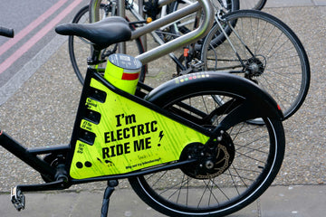 Freebike electric rental bike parked in London with bold branding promoting affordable e-bike sharing.