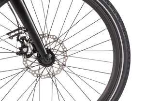 Front wheel of the Wisper 905 Touring e-bike featuring precision disc brakes and robust tyre design.