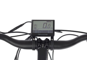 Close-up of Wisper Trail Tailwind electric bike LCD display showing speed, power assist level, and trip data at glide & gear